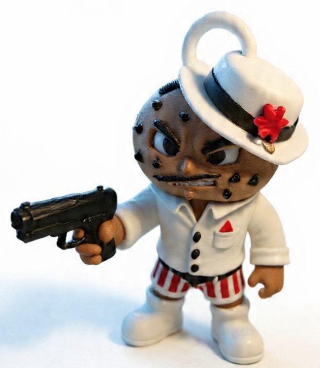 Finished 3D print of a tough-looking gang boss mascot in a suit and hat named Muff Daddy
